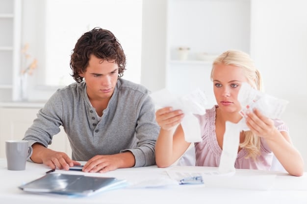 A family sitting at a table, looking concerned while reviewing financial documents, with a calculator and a home key visible on the table.
