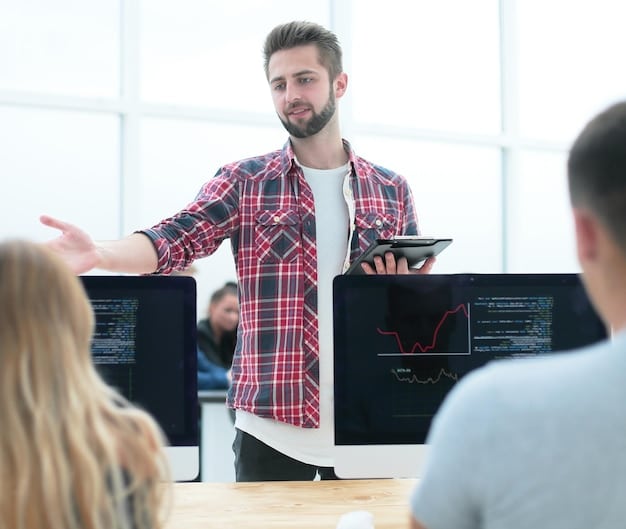 A photo of a German IT professional leading a training session on a low-code/no-code platform, with diverse employees actively participating and engaged in learning. The setting is a modern training room equipped with technology.
