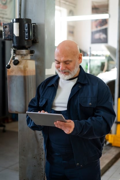 An employee in a German factory is using a tablet computer to monitor a production process. The tablet displays real-time data and analytics, and the employee is using the information to make adjustments to the process. The scene shows the integration of digital technology into the traditional manufacturing environment.