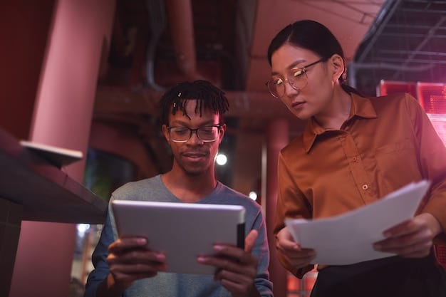 A diverse team collaborating on a digital marketing strategy using tablets and laptops, showcasing how digitalization enhances teamwork.