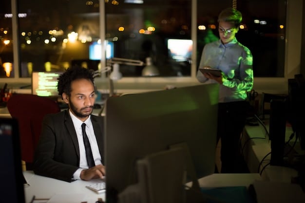 An image of diverse professionals in a modern office setting, participating in a simulated cybersecurity training exercise on their computers. The scene should convey a sense of collaboration and focus on security awareness.