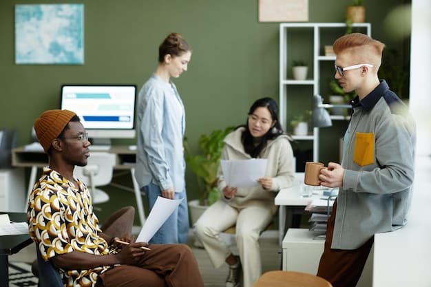 A group of diverse employees collaborating in a modern office space. They are engaged in a discussion, and their body language suggests a collaborative and inclusive environment.