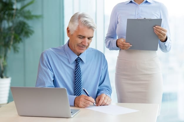 A modern office scene with a financial advisor sitting at a desk explaining the pension reform and holding an information sheet to a senior citizen.