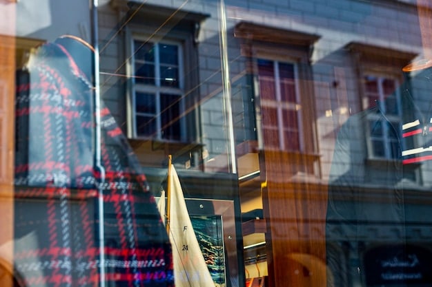 A photo depicting a row of closed storefronts in a German city, symbolizing the economic impact of a recession on small businesses. The image is slightly desaturated to convey a sense of hardship.
